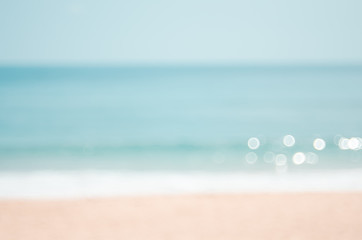 Wall Mural - blur tropical beach with bokeh sun light wave abstract background.