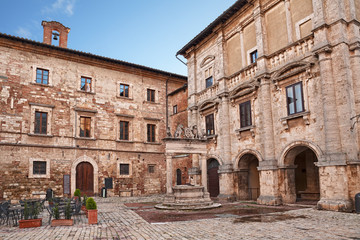 Wall Mural - Montepulciano, Siena, Tuscany, Italy: corner of the main square Piazza Grande with the ancient Griffin and Lion Well (1520)