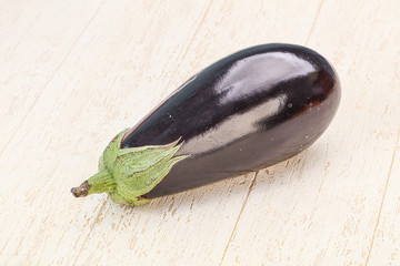 Black ripe fresh eggplant over background