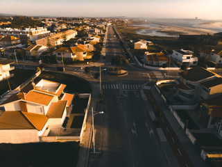 The marginal riverside, along the mouth of the Cavado River at sunset in Esposende, Portugal. The two sides of Restinga de Ofir. One facing the ocean, the other the estuary of Cávado River.