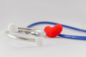 Blue stethoscope medical and red heart on white background. Idea for doctor diagnostic disease.