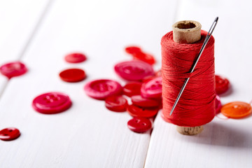 Poster - Background and texture of multicolored antique buttons and sewing tools