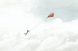 © fran_kie - man flying with his red kite in the sky, surreal