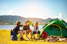 Team Of Asian Climbers Hiker Are Sitting And Enjoying A Drink After A Set Up Outdoor Tent In The Forest Path Autumn Season. Hiking, Hiker, Team, Forest, Camping , Activity Concept.