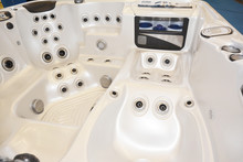 A Close Up On A White Acrylic Hot Tub, Spa Tub, Whirlpool, Showing Vents, Stainless Steel Jets For Water Circulation And Massage.