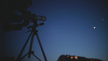 amateur astronomer looking at the stars with a telescope. astronomy and astrology concept.