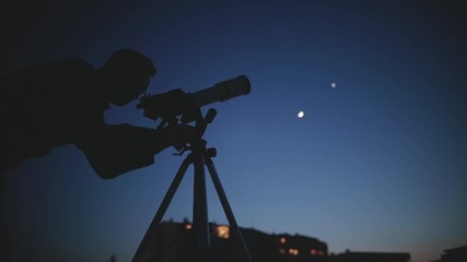 amateur astronomer looking at the stars with a telescope. astronomy and astrology concept.
