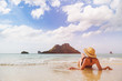 © o_lypa - Woman in hat take tan at beach