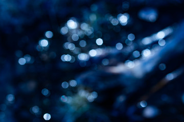 Wall Mural - Beautiful lights bokeh reflecting from spring water.