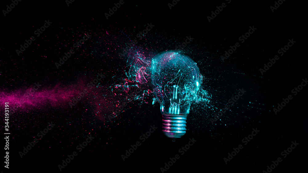 explosion of a traditional electric bulb. - obrazy, fototapety, plakaty 