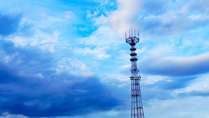 Panoramic view of big television and radio tower on the classic blue sky background. Space for text.