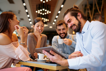 Sticker - Group of Happy friends having with digital tablet in cafe