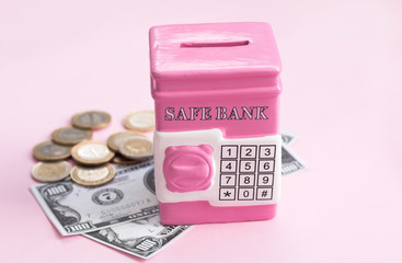 money box on pink background