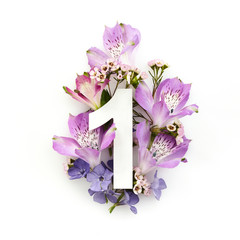 Wall Mural - Creative layout with colourful flowers and number one. Flat lay. Top view.