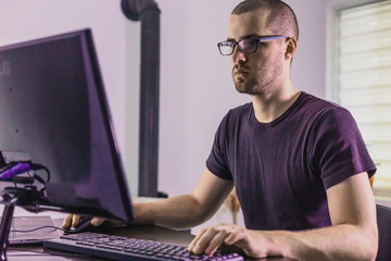 computer programmer in glasses. information technology. women in business. the guy works from home.