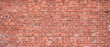 Texture of an old red brick wall as background or wallpaper