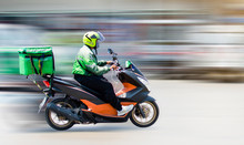 Food Delivery Staff Drive Motorbikes And Rush To Deliver Food To Customers Who Order Food Online. Due To The Impact Of The Virus Spread, Most People Live In Ban Nonthaburi, Thailand On 22/04/2020.
