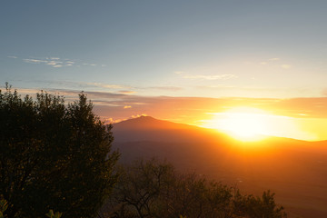 Wall Mural - 2020-04-26 BRIGHT SUNSET OVER A VALLEY WITH BLUE SKY