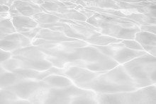Closeup Of Desaturated Transparent Clear Calm Water Surface Texture With Splashes And Bubbles. Trendy Abstract Nature Background. 