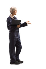 Sticker - Young woman worker in an overall uniform holding a clipboard with document