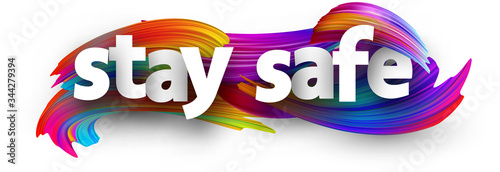 Fotografía Stay safe sign over brush strokes background.