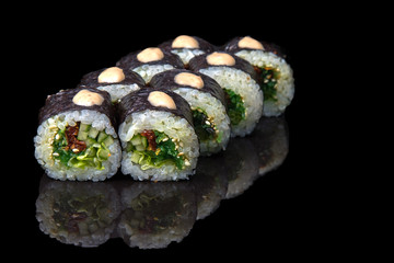 Wall Mural - stuffed sushi on a dark background