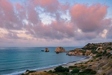 Cyprus. Aphrodite's rock on a cloudy day. Rock in the sea under the clouds. Panorama of the Mediterranean coast. Pathos. Petra tou Romiou. Kuklia. Natural attractions of Cyprus.