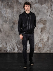 Full length studio portrait of attractive young man. Young Male Fashion Model Posing In Casual Outfit. 