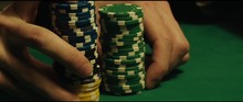 Close-up Of Person Holding Gambling Chips