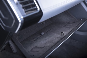 Closeup shot of an open glove compartment in a modern car