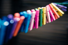Close-up Of Colorful Clothespins Hanging On Clothesline
