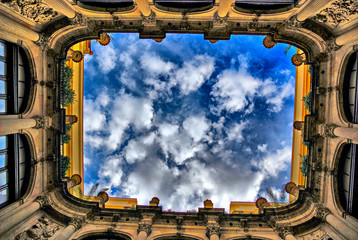 Sticker - synthetic sblue sky among the buildings in the inner courtyardports field for leisure