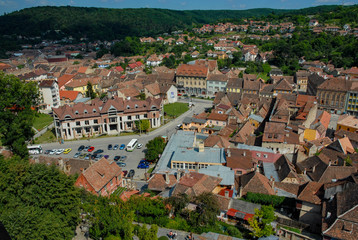 Wall Mural - the city seen from above with the roofs of houses and churches