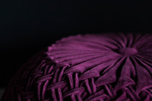 Close-up Of Purple Seat Against Black Background