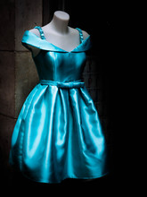 Blue Dress In Mannequin Against Wall