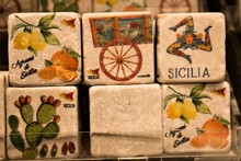 Colored Images Reproduced On Cube-shaped Stones Promoting The Sicily Region In Italy 
Depicting Citrus Fruits, Lemons, Oranges, Cactuses Typical Sicilian Cart And 
Female Head With Three Folded Legs C