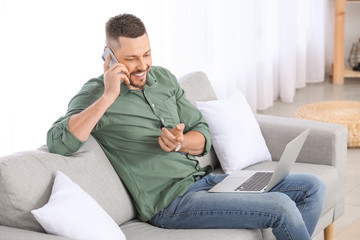 Wall Mural - Handsome businessman working at home