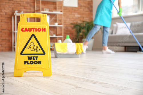Fotomural Caution sign with text WET FLOOR in room