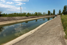 Crimea, Russia, 2014: Rice Irrigation Canal After Fresh Water Inflow Plate From Mainland Ukraine. Water Crimea Blockade Artificial Drought, Collapse Of Agriculture Irrigated Agriculture