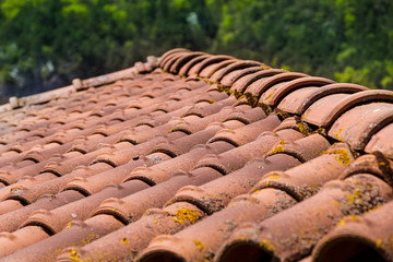 Closeup of the red clay roof tiles. selective focus