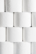 Front view of neatly stacked toilet paper rolls