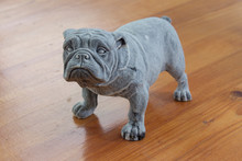 A Statuette Of An English Bulldog In A Pose For Reference
