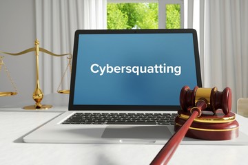 Wall Mural - Cybersquatting – Law, Judgment, Web. Laptop in the office with term on the screen. Hammer, Libra, Lawyer.