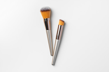 Poster - Make-up brushes isolated over white background