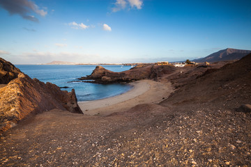 Wall Mural - Lanzarote island volcanic coastline landscape. Beach and ocean view. Canary Island, Spain