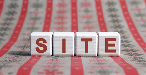Poster - Site concept on wooden cubes on a striped orange background