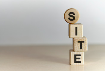 Poster - Site text concept on vertical wooden cubes