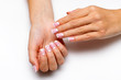 wedding french manicure with silver on short square nails closeup on a white background