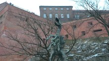 Wawel Dragon Statue Is A Monument At The Foot Of The Wawel Hill In Krakow, Poland, In Front Of The Wawel Dragon's Den, Dedicated To The Mythical Wawel Dragon.