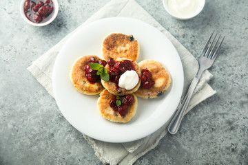 Wall Mural - Homemade cottage cheese cakes with cherry sauce